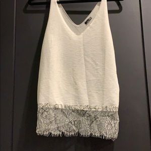 White top with black and white lace trim